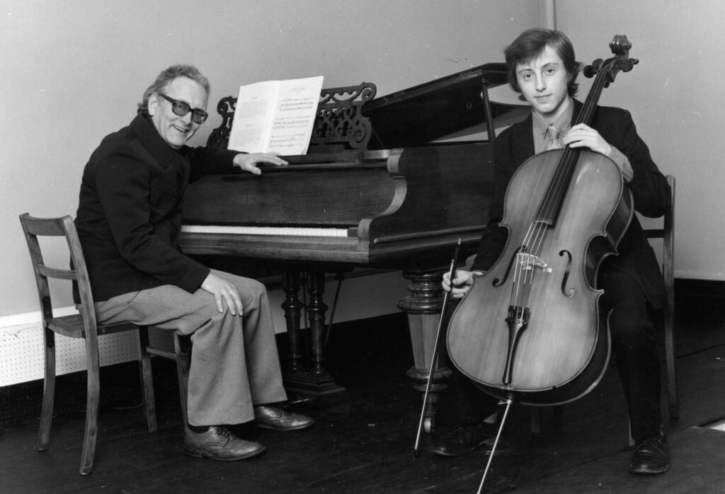 Mark Slater performing cello with his father Christopher at the piano