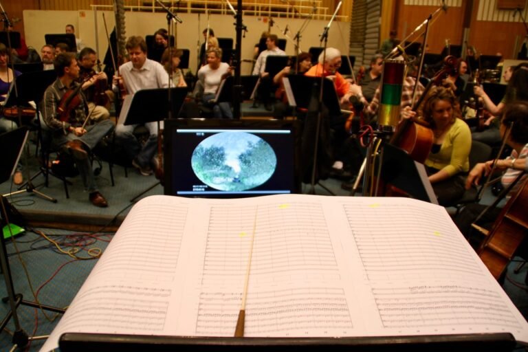 The podium — score, baton, and monitor